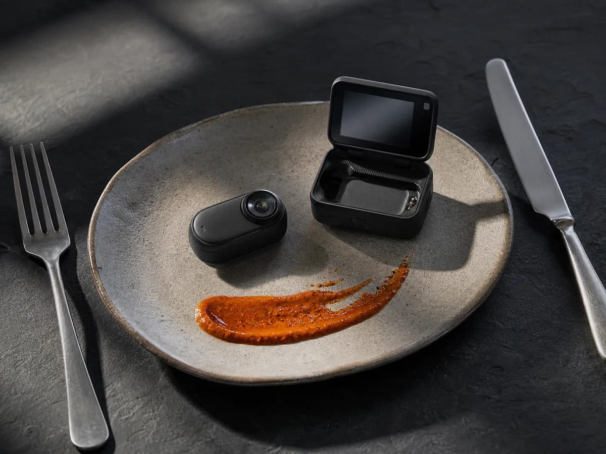 GO Ultra resting on an oval stoneware plate between a fork and knife, a smear of paprika sauce beside it